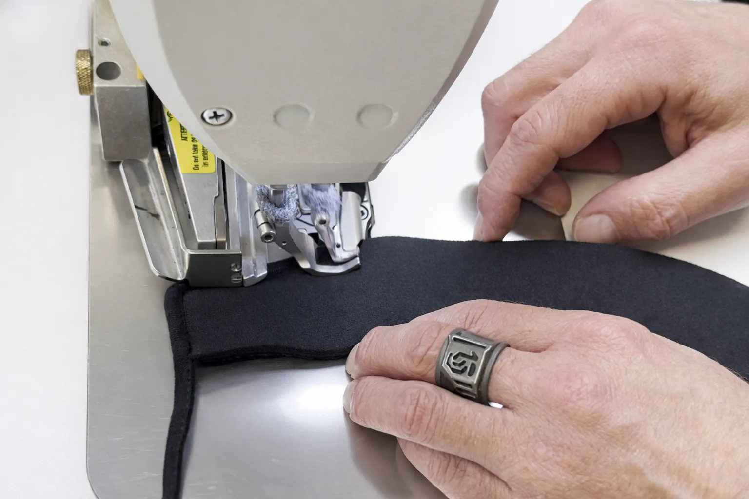 Manual sewing of textile